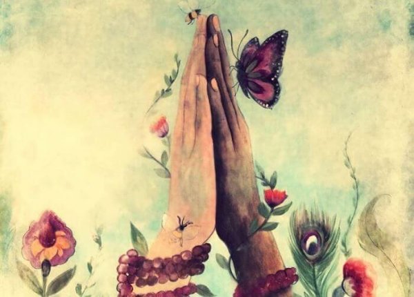 To hænder er samlet med blomster og sommerfugle omkring