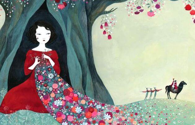 Kvinde sidder i træ med blomstertæppe