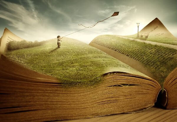 Et barn flyver med drage i en bog