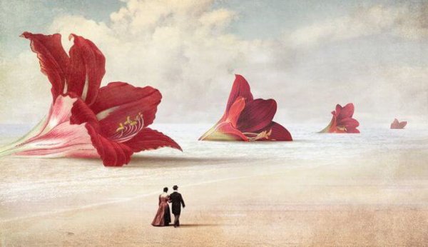Par går på en strand med gigantiske blomster