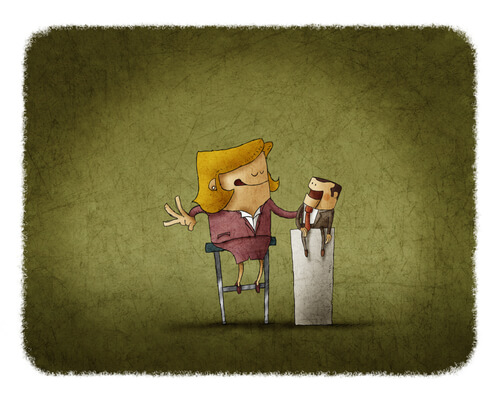 Chef og ansat sidder og snakker sammen