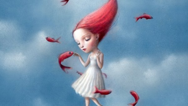 Pige med rødt hår rører ved fisk for at undgå at føle vrede