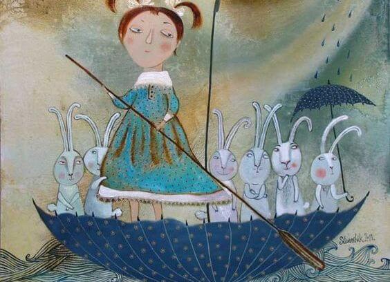 Pige i omvendt paraply med kaniner forstår, hvordan man skal leve sammen