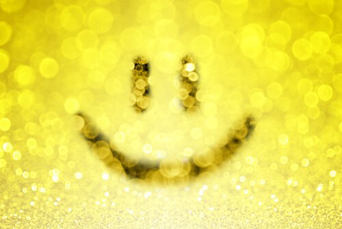 En smiley symboliserer den positive holdning ved uimodståelige mennesker