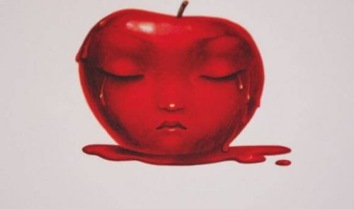 Trist ansigt på rødt æble
