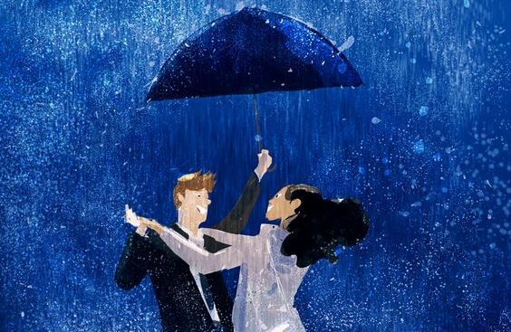 Par danser i regnen under paraply