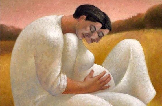 En far krammer gravid mor