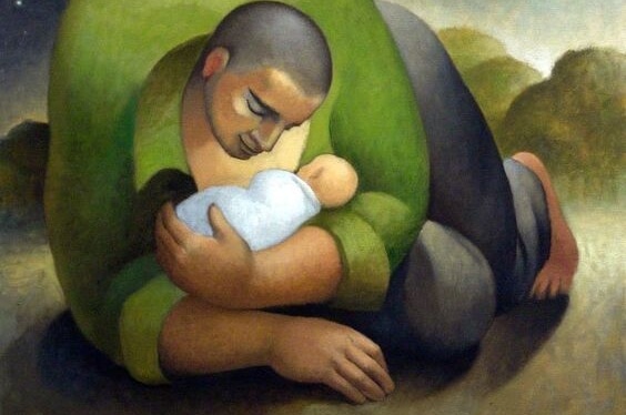 En far krammer sin baby