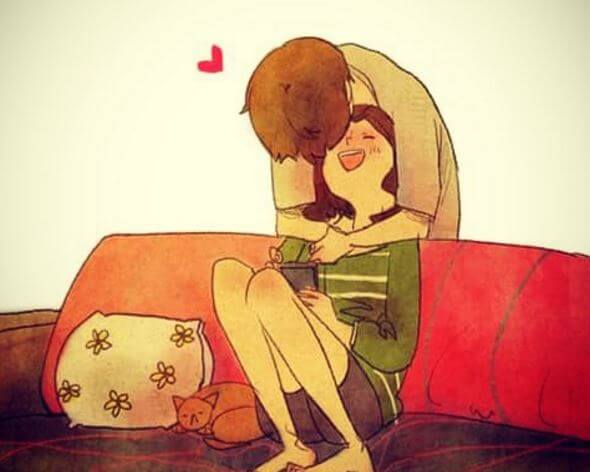 Mand kysser kvinde i sofa, da han er sammen med den ideelle partner