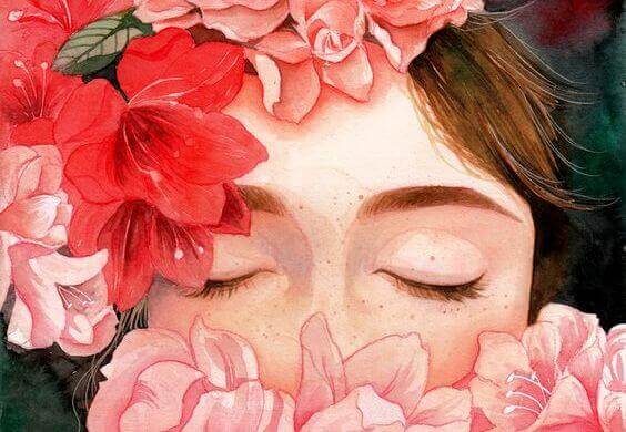 Kvinde med lukkede øjne og blomster omkring sig