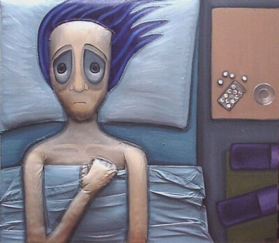 Person ligger vågen i seng på grund af natlig angst