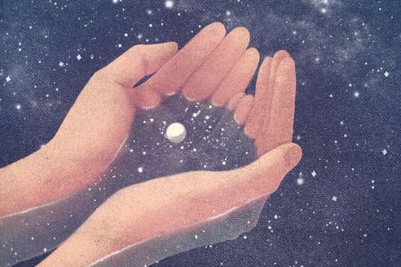 Hænder indsamler stjernestøv i univers