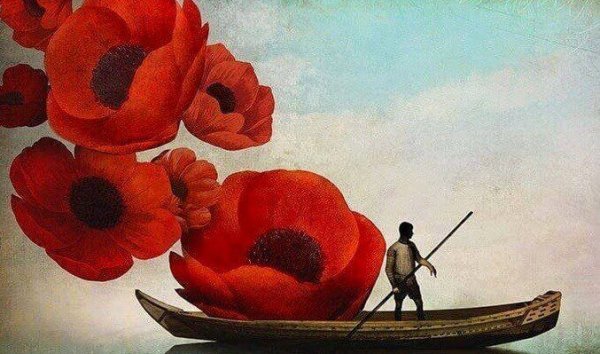 Person i båd med kæmpe blomster