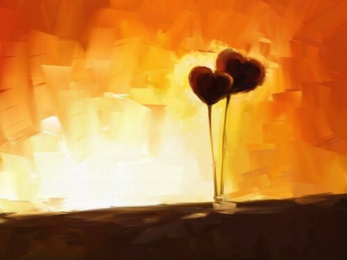 To hjerter foran orange baggrund