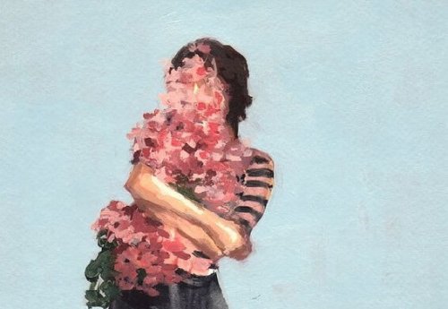 Kvinde dækket af blomster ønsker sige "jeg vil elske mig selv"