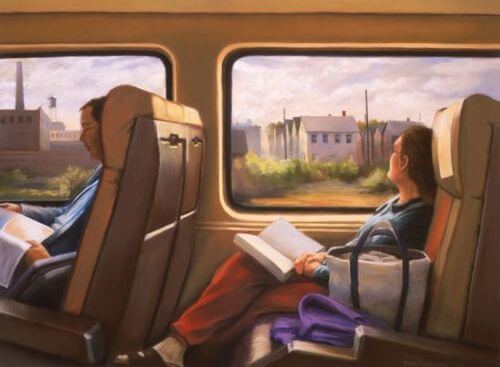 Kvinde i tog med bog