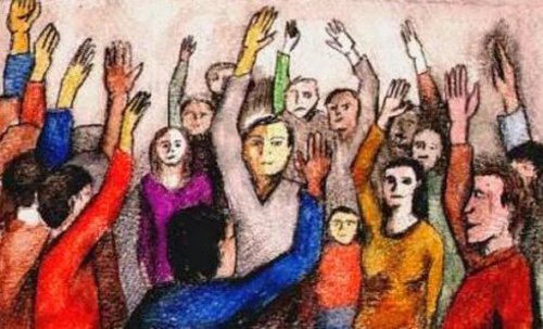 Folk med hænderne oppe viser, hvordan grupperfølelser kan gøre os voldelige