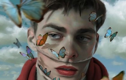dreng med sommerfugle omkring ansigtet