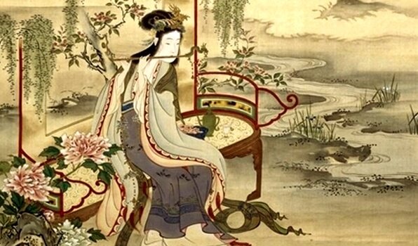 Kvinde i Kina sidder på bænk