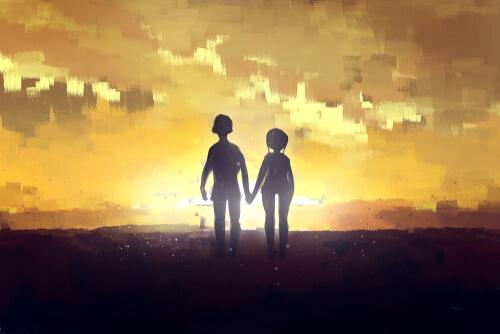 Silhuet af et par foran solopgang