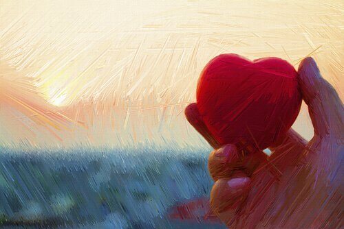 Maleri af hånd, der holder hjerte