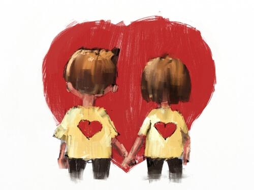 Et par holder i hånd foran hjerte