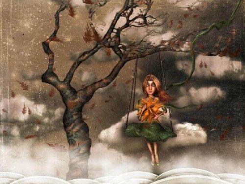 Dyster kvinde på gynge i vissent træ