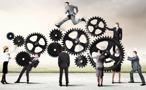 Forretningsfolk og tandhjul