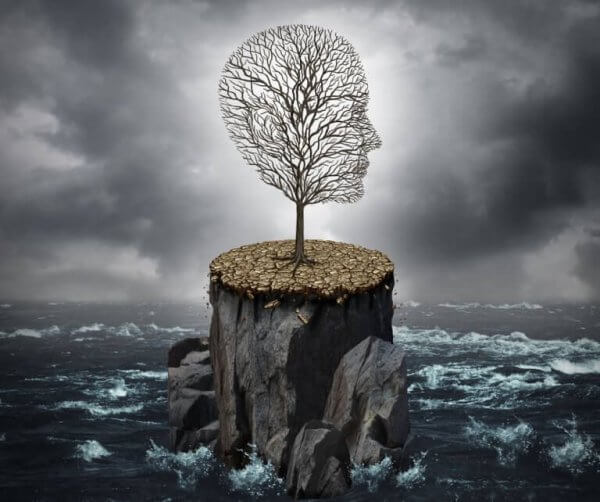 Et ensomt træ i en storm er formet som et hoved
