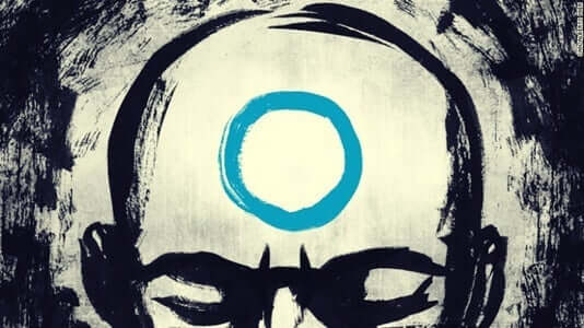 mand med blå cirkel i panden