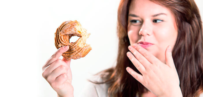 Kvinde med donut mærker forbindelsen mellem overvægt og skyld