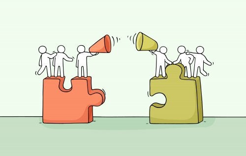 To grupper står på hver deres puslespilsbrik