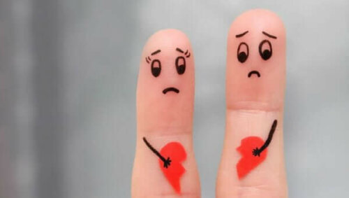 Kærestesorg illustreres af to fingre med knuste hjerter